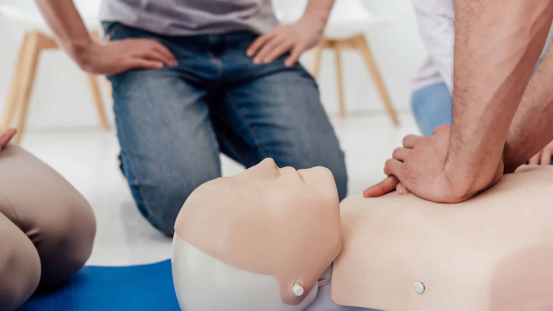medical personnel practicing CPR